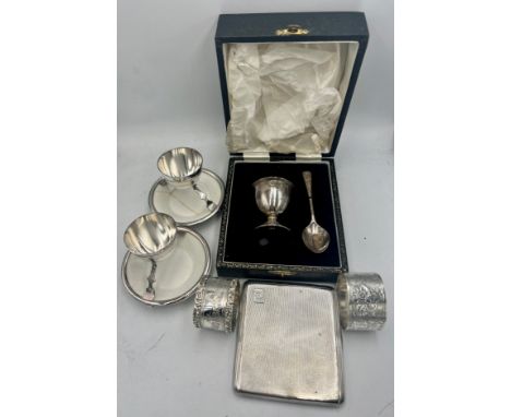 Hallmarked silver to include boxed egg cup and spoon, two napkin rings, cigarette case together with two silver plated and ce