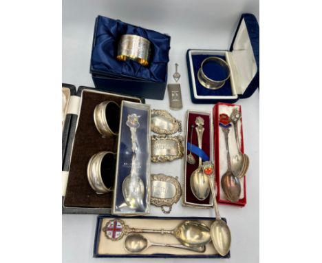 A selection of various silver items to include 4 hallmarked silver napkins, 3 hallmarked silver decanter labels, silver Mason