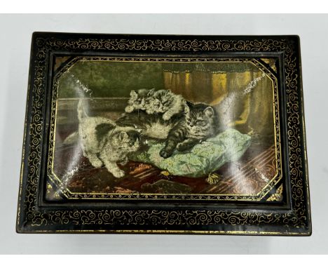 A vintage tin decorated with playful cats with oval mirror to inner lid. 28.5 l x 20 w x 11cm h.