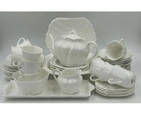 Shelley white glazed porcelain tea service with two registration numbers 735121 and 272101 consisting of: teapot, sugar, milk