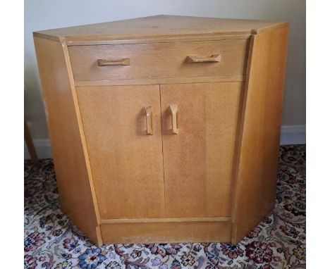 A mid 20thC G Plan E Gomme corner cupboard with secretaire drawer to top. 80cm h x 70cm w x 65cm d.