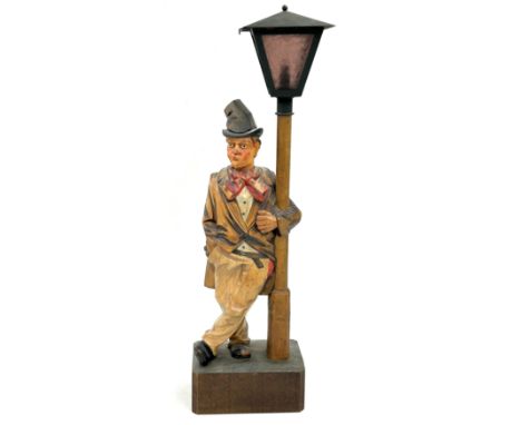 A 1930's German wood 'Whistling Tramp automaton table lamp, whistles to the tune 'Ah my little Augustine' probably by Karl Gr