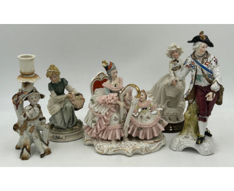 Five early 20thC figurines to include a Dresden 'Mother &amp; Child' with harp 18cm h with mark to base, 'Hunter' Chelsea por