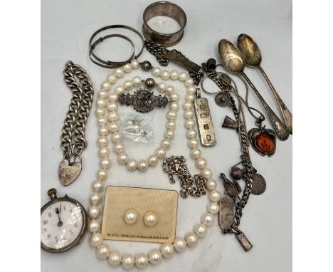 A quantity of vintage silver and jewellery to include continental silver pocket watch, two spoons, a napkin ring, 1977 silver
