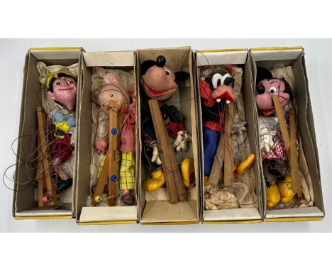 Five vintage Pelham Puppets to include Pinocchio, Mickey Mouse, Minnie Mouse, Goofy and Rupert The Bear 30cm h. (5).