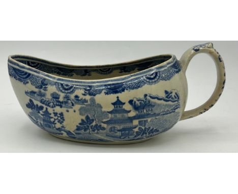 An early 19th century blue and white transfer printed Spode Queen Charlotte pattern bourdaloue, c. 1820. 26 cm wide. (1)