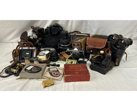 A collection of cameras to include Canon, SX30 IS with case, Super Paragon mirror lens, Minolta 45mm lens, Kodak 'Brownie' Fl