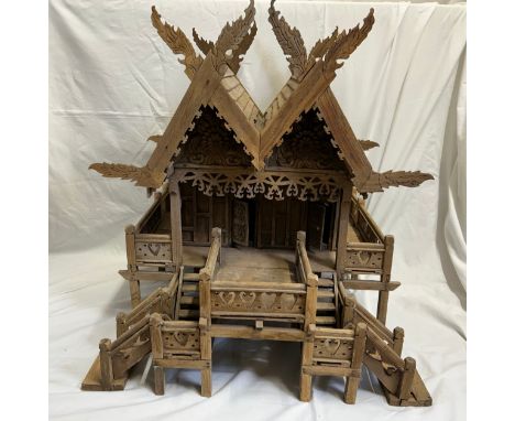 A vintage hand built wooden model of a Thai stilt house. 56cm h x 62cm x 60cm.