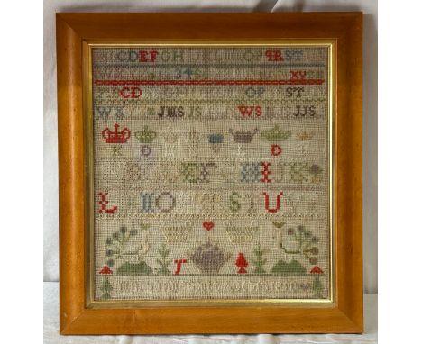 A 19thC cross stitch sampler dated 1890 in the name of Mary Jane Smith, frame 49cm x 47cm.