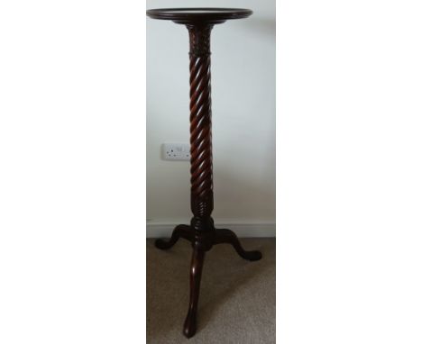 A mahogany torchère with twisted column on tripod base.&nbsp;105cm h.