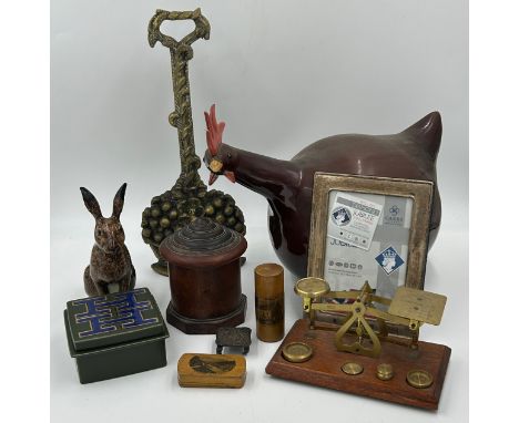 A miscellany lot to include a brass door stop, miniature silver table a Longchamp pottery chicken measuring 35cm tail to beak