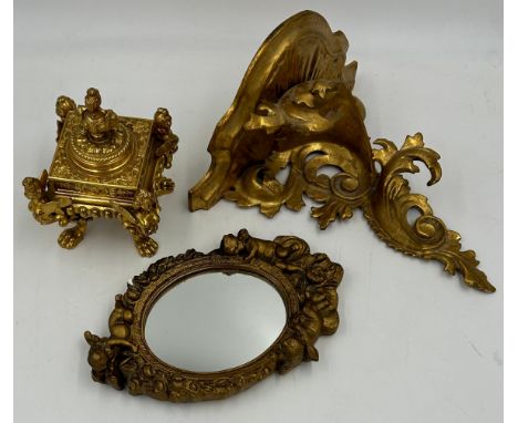 An ornate square gilt metal inkwell, approx. 9cm square together with a gilt Rococo style bracket 25 h x 23.5cm w and a small