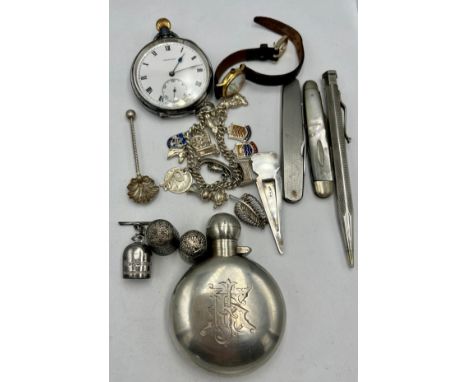 A miscellaneous lot to include .925 silver pocket watch, two Charles Horner Dorcas thimbles, fruit knives, silver charm brace