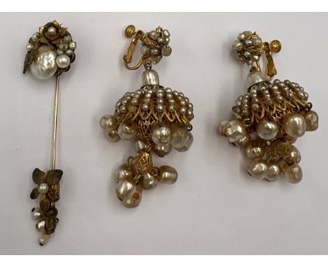 A pair of vintage Miriam Haskell simulated pearl and paste set screw back earrings together with a simulated pearl stick pin.
