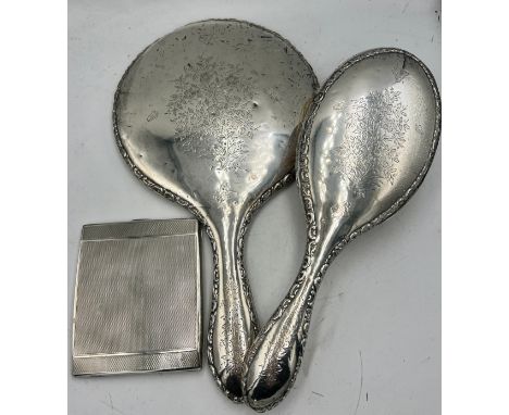 Silver backed mirror and hairbrush, Chester 1908 together with a silver cigarette case Chester 1934, weight 130gm.