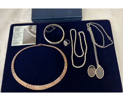 A quantity of silver jewellery to include a Cleopatra collar necklace, marked Italy .925, an engraved bangle, Birmingham, mak