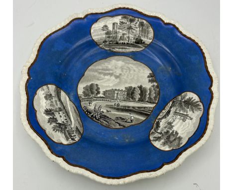 An early 19th century Spode gadrooned plate printed with a scene of Knypersley Hall on a blue ground, c. 1832. 25 cm wide. (1