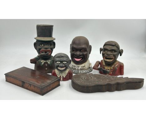 A collection of cast iron Novelty Money Boxes to include Salted Peanut Man, Top Hat Man and others along with 2 x boxed trave