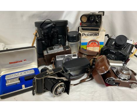 A collection of camera equipment comprising: a Yashica TL- Super No 57062693 auto Yashinon- DX 1:17 f= 50mm,  Kodak Retinette