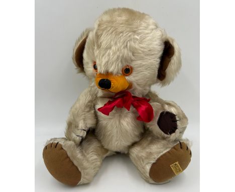 A Vintage Merrythought 'Cheeky Bear' with blonde fur, amber &amp; black beaded eyes, felt stitched nose, felt paws, bell to e