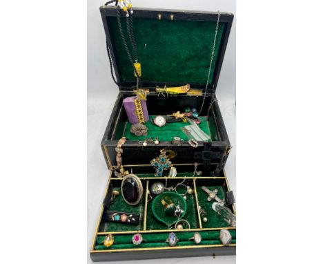 A 19thC leather covered jewellery box and contents of 19th and early 20thC jewellery to include 9 carat gold and silver ring,