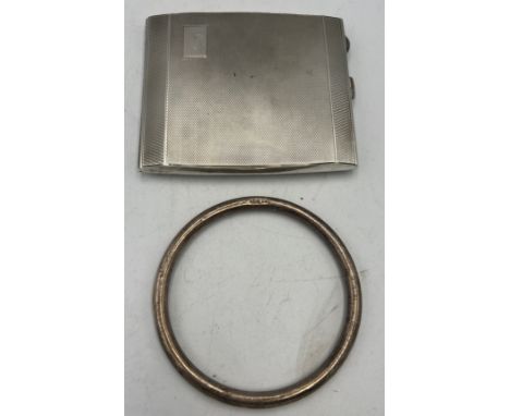 Silver cigarette case Birmingham 1946, together with a silver bangle Birmingham 1922. Total weight 147gm.