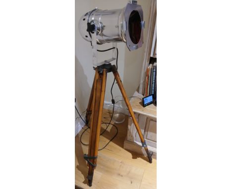 A chrome lamp on wooden tripod base.&nbsp;134cm h.