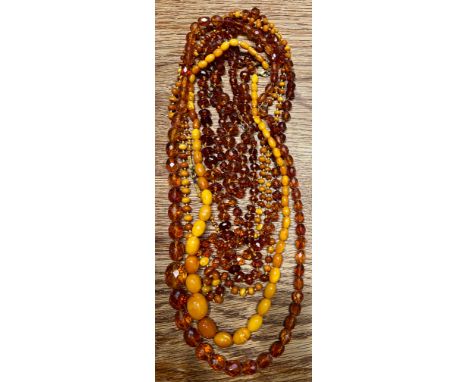 Six strings of vintage amber beads.