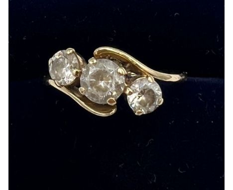 A QVC 14 carat gold ring set with three CZ. Size K. Weight 1.8gm.