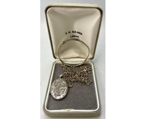 Hallmarked silver to include a locket, Birmingham 1978 maker H G &amp; S, a silver chain, marks indistinct and a child's bang
