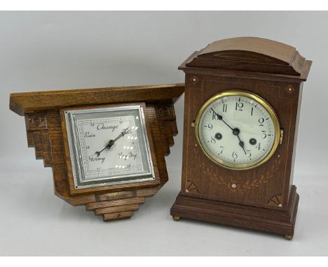 A mahogany mantel clock, inlaid with satinwood and mother of pearl with enamelled face 32cm x 21.5cm x 13.5cm with key and pe