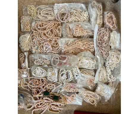 A large quantity of cultured, seed and simulated pearl necklaces and loose beads.