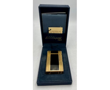 ST Dupont Paris gold plated and lacquer lighter with original box and paperwork.