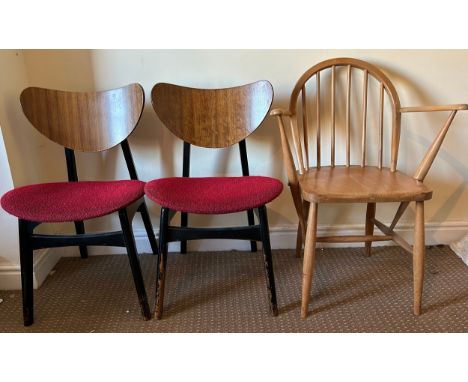Three mid century chairs. An Ercol stick back armchair 84cm to back, 43cm to seat with label to rear and two G Plan dining ch