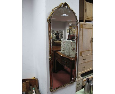 An Arched Wall Mirror, bevelled glass with amber glass borders, applied gilt scrolled cresting, all over single shelf with br