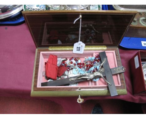 Wooden Crucifix; together with rosary beads, pendants, including mother of pearl etc. Contained in an Italian musical jewelle