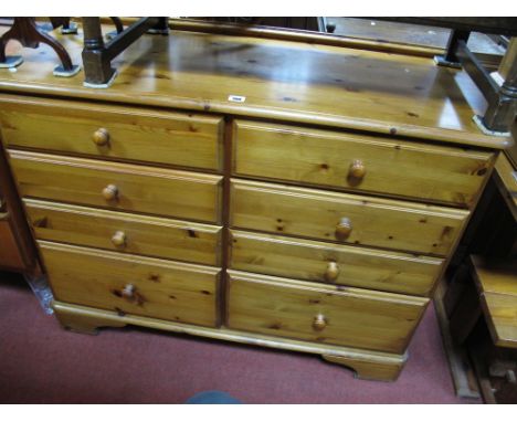 A Modern Pine Chest, incorporating two banks of four drawers, bracket feet.
