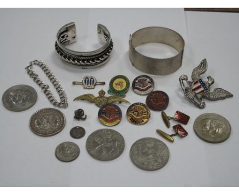 A Heavy Bangle, with twisted detail, further bangle, coins, RAF wings brooch, Swimming Association enamel badges etc. 
