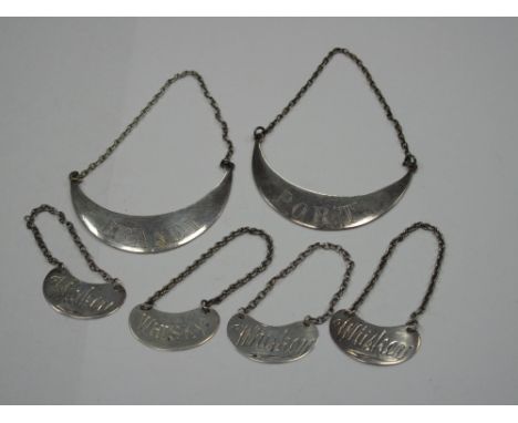 Three Hallmarked Silver Kidney Shape Decanter Labels, "Whisky"; together with another "Whisky", each on chain suspension; tog