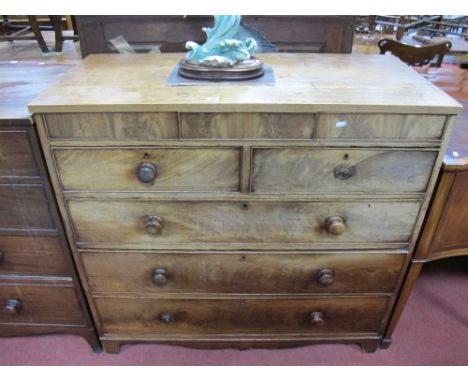 A George III Mahogany Chest of Drawers, plain frieze with central secret drawer, over two short and three long graduating dra