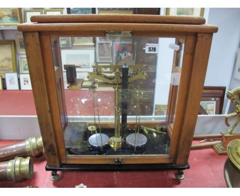 Set of Oertling Balance Scales, model 101, in glazed display case, together with bakelite cased W&J George Weights. 