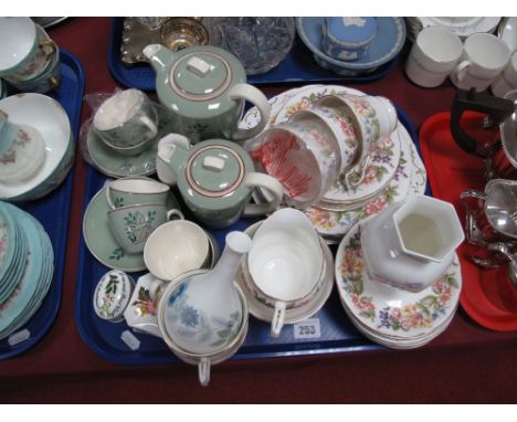 A Poole Part Coffee Service, decorated with leaping deer on a pastel green ground, a Paragon "Country Lane" part tea service,