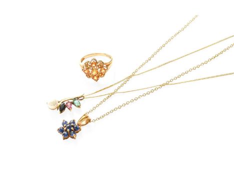 A Star Sapphire Pendant on Chain, the cluster formed of round cabochon star sapphires, in yellow claw settings, on a trace li