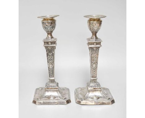 A Victorian Silver Candlestick and a George V Silver Candlestick, The First by Walter Latham, Sheffield, 1899 and The Second 