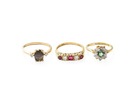 A Ruby and Diamond Five Stone Ring, three round cut rubies alternate with two round brilliant cut diamonds, in yellow claw se