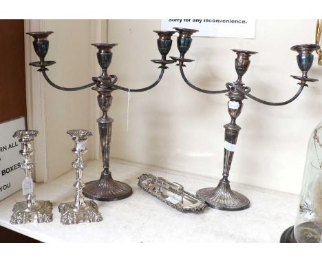 A Pair of Silver Plate Three-Light Candelabra, each on fluted oval base, 47cm high; Together With a pair of silver plate cand