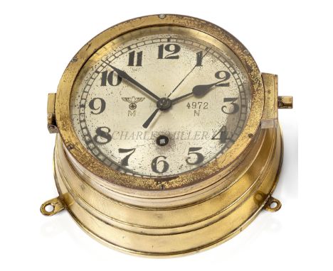 A KRIEGSMARINE U-BOAT BULKHEAD CLOCKthe 6¼in. silvered dial marked with Kriegsmarine device numbered 4972 / N, black spade ha