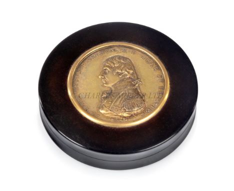 A CIRCULAR TORTOISESHELL SNUFF BOX COMMEMORATING ADMIRAL LORD NELSON, CIRCA 1805the lid set with an apparently gold cliché of