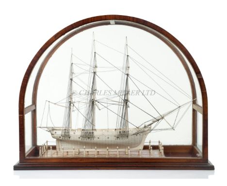 Ø A FINE AND RARE WHALEBONE MODEL OF A WHALING SHIP, CIRCA 1820the 19in. hull with uninterrupted planks with copper pins, bal