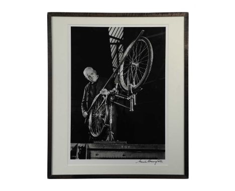Maurice Broomfield (1916-2010), 'Truing a Bicycle Wheel' [Raleigh Factory, Nottingham, 1954], photograph, signed, 53 x 38cmMa